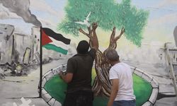 BM İklim Zirvesi sürerken, Gazze'de İsrail'in uyguladığı ekokırım duvar resmiyle anlatıldı